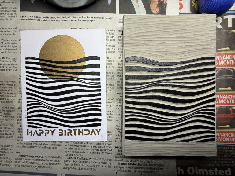 Image of print and plate on workbench